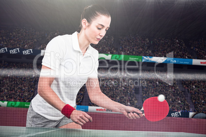 Composite image of female athlete playing ping pong