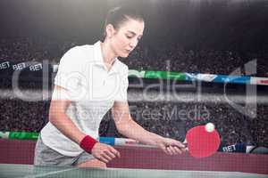 Composite image of female athlete playing ping pong