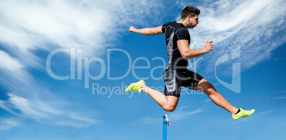 Composite image of athletic man practicing show jumping