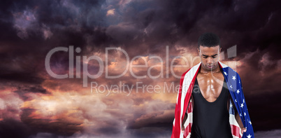 Athlete with american flag wrapped around his body