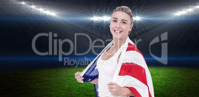 Composite image of female athlete with american flag on her shou