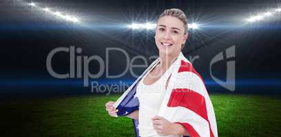 Composite image of female athlete with american flag on her shou