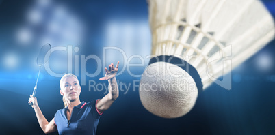 Composite image of badminton player playing badminton