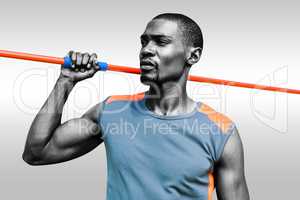 Composite image of athletic man preparing to throw javeline