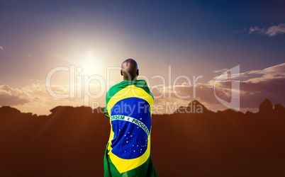 Composite image of rear view of brazilian sportsman