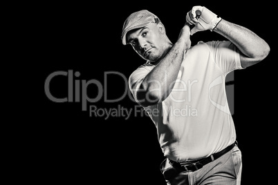 Portrait of golf player taking a shot