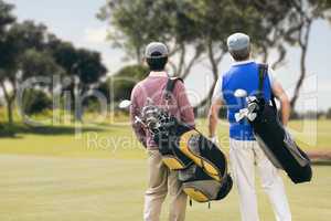 Composite image of men carrying golf equipment