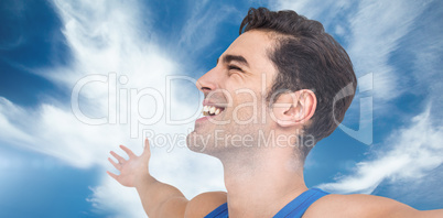 Composite image of excited male athlete with arms outstretched