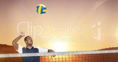 Composite image of sportsman posing while playing volleyball