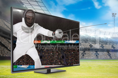 Composite image of man wearing fencing suit practicing with swor