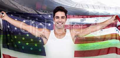 Composite image of athlete posing with american flag after victo