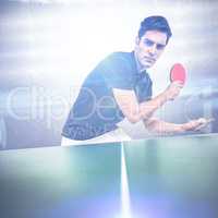 Composite image of confident male athlete playing table tennis