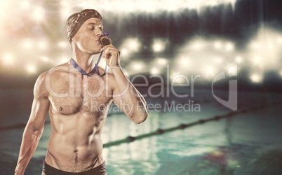 Composite image of swimmer kissing his gold medal