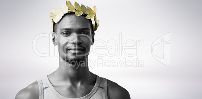 Portrait of victorious sportsman with crown of laurels