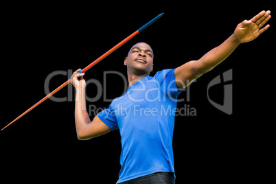 Composite image of concentrated sportsman practising javelin thr