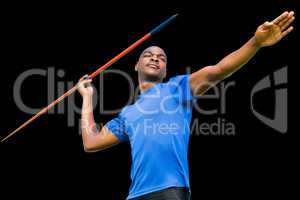 Composite image of concentrated sportsman practising javelin thr