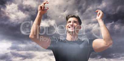 Composite image of portrait of happy sportsman