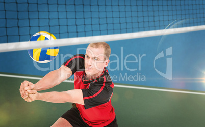 Composite image of sportsman posing while playing volleyball