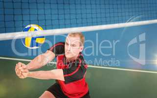 Composite image of sportsman posing while playing volleyball