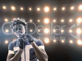 Composite image of athletic man putting his cycling helmet