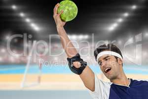 Composite image of sportsman holding a ball on white background