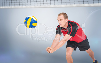 Composite image of sportsman posing while playing volleyball