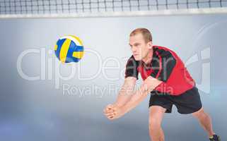 Composite image of sportsman posing while playing volleyball