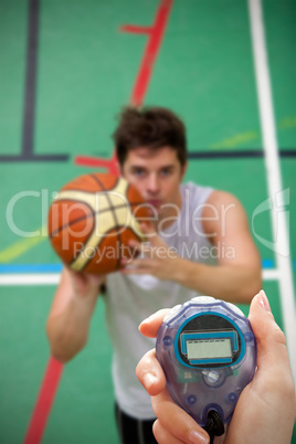 Composite image of close up of woman is holding a stopwatch on a