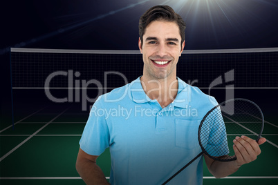 Composite image of badminton player holding badminton racket