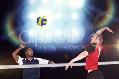 Composite image of sportsman hitting volleyball