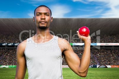 Composite image of portrait of serious sportsman is holding a sh