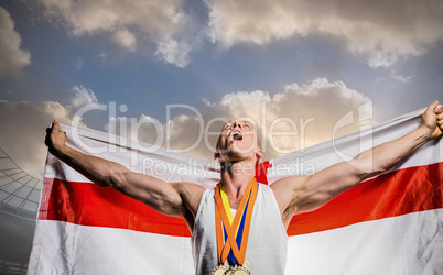 Composite image of athlete posing with gold medals after victory