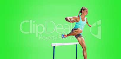 Sportswoman practising the hurdles