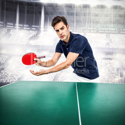 Composite image of confident male athlete playing table tennis