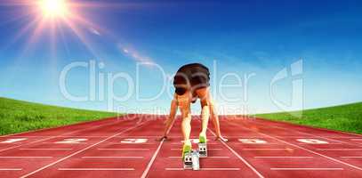 Composite image of sportsman in starting block
