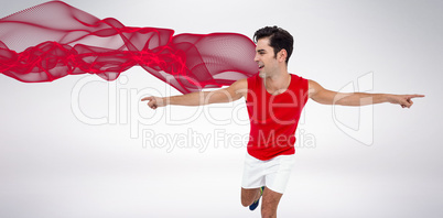 Composite image of excited male athlete with arms outstretched