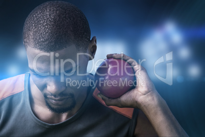 Composite image of portrait of sportsman practising shot put