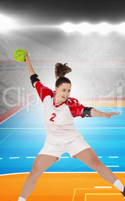 Composite image of sportswoman throwing a ball