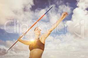 Composite image of low angle view of sportswoman is practising j