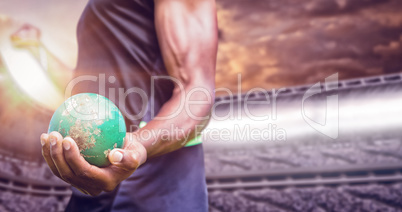 Composite image of focus on man holding hammer