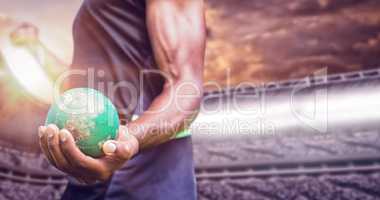 Composite image of focus on man holding hammer