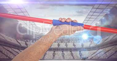 Composite image of male athlete holding javelin