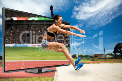 Composite image of sportswoman jumping on a white background