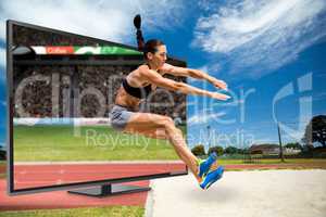 Composite image of sportswoman jumping on a white background