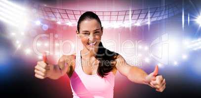 Composite image of portrait of sportswoman is smiling with thumb