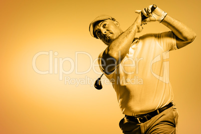Portrait of golf player taking a shot