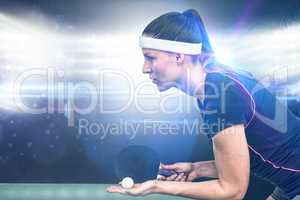 Composite image of female athlete playing table tennis