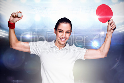 Composite image of female athlete winning a ping pong match