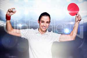 Composite image of female athlete winning a ping pong match