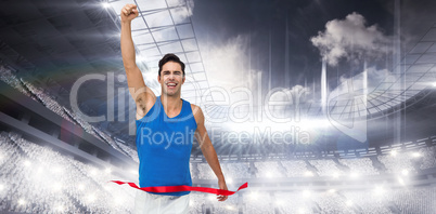 Composite image of portrait of cheerful winner athlete crossing